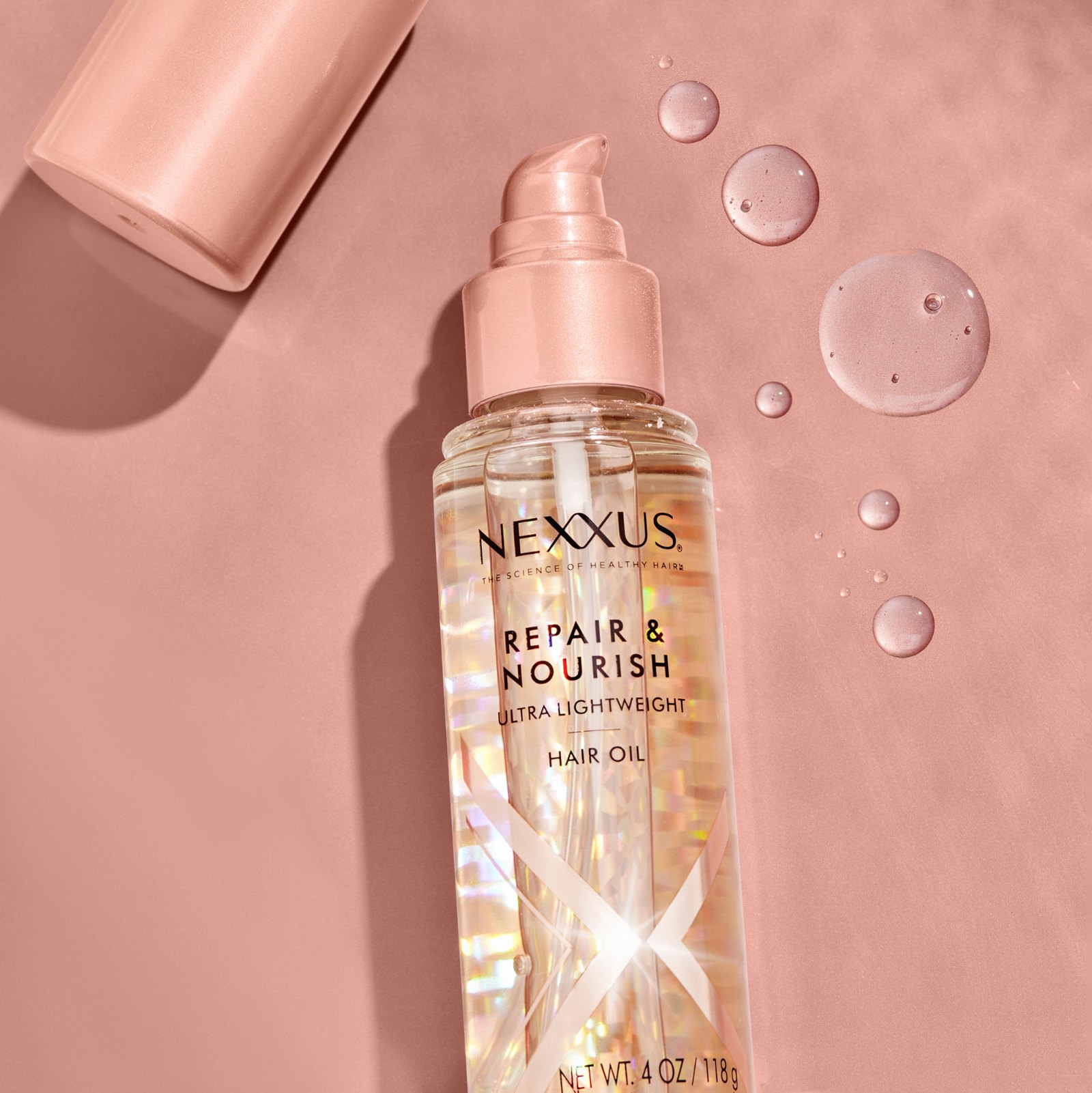 Nexxus Repair & Nourish hair oil with droplets