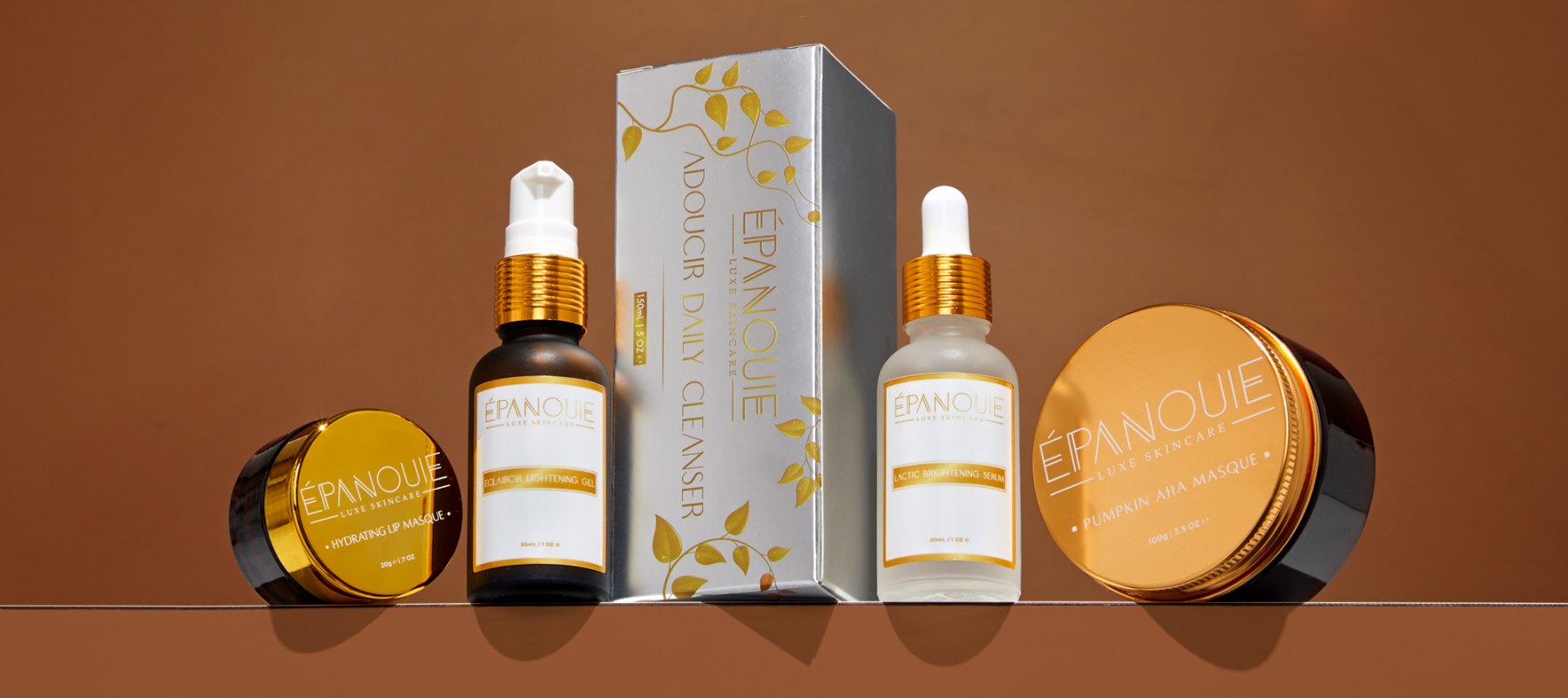 Épanouie skincare collection on bronze shelf