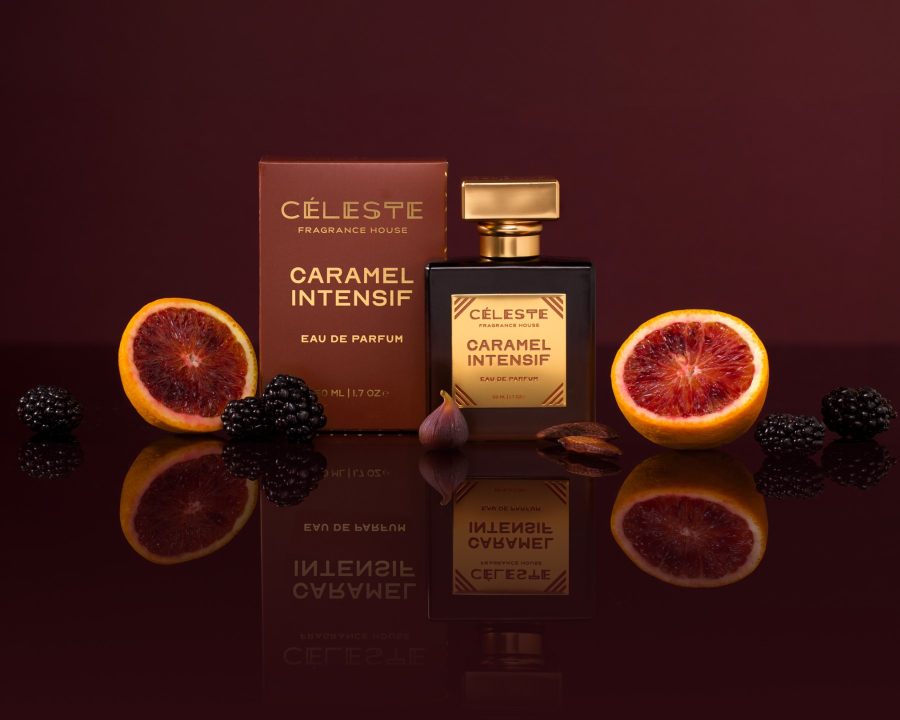 Céleste Caramel Intensif bottle and box with blood orange and blackberries