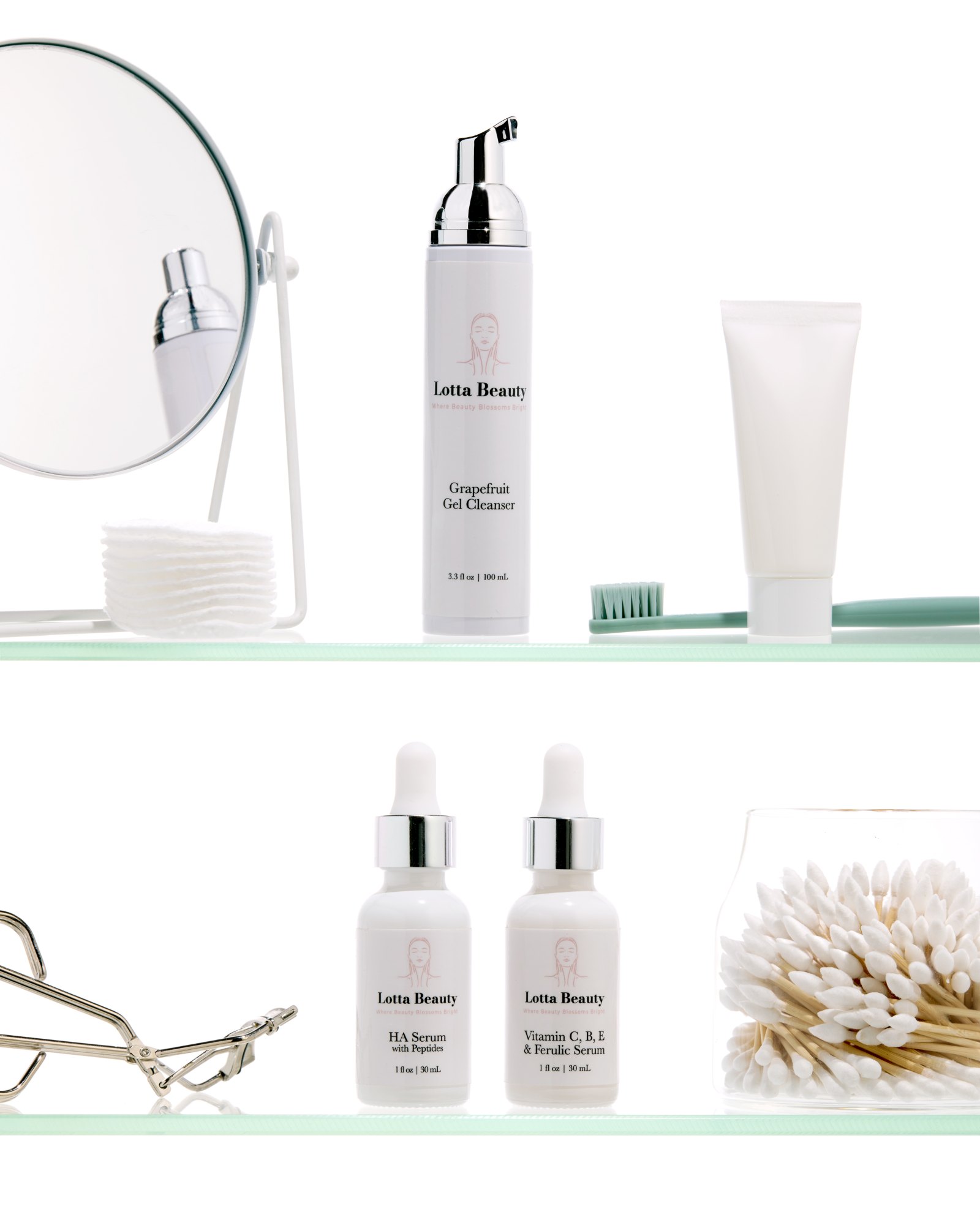Lotta Beauty cleanser and serums on glass shelves