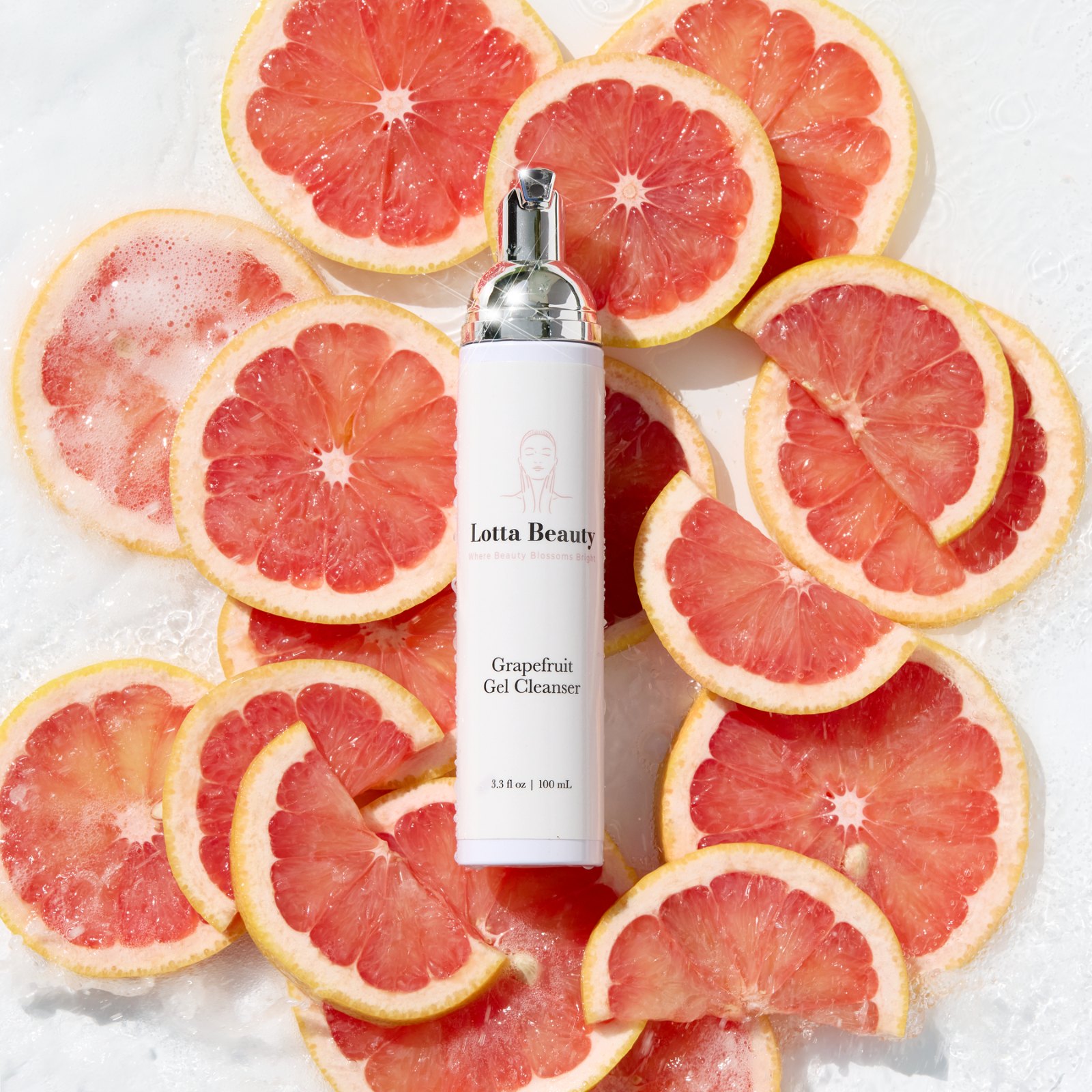 Lotta Beauty Grapefruit Gel Cleanser on grapefruit slices