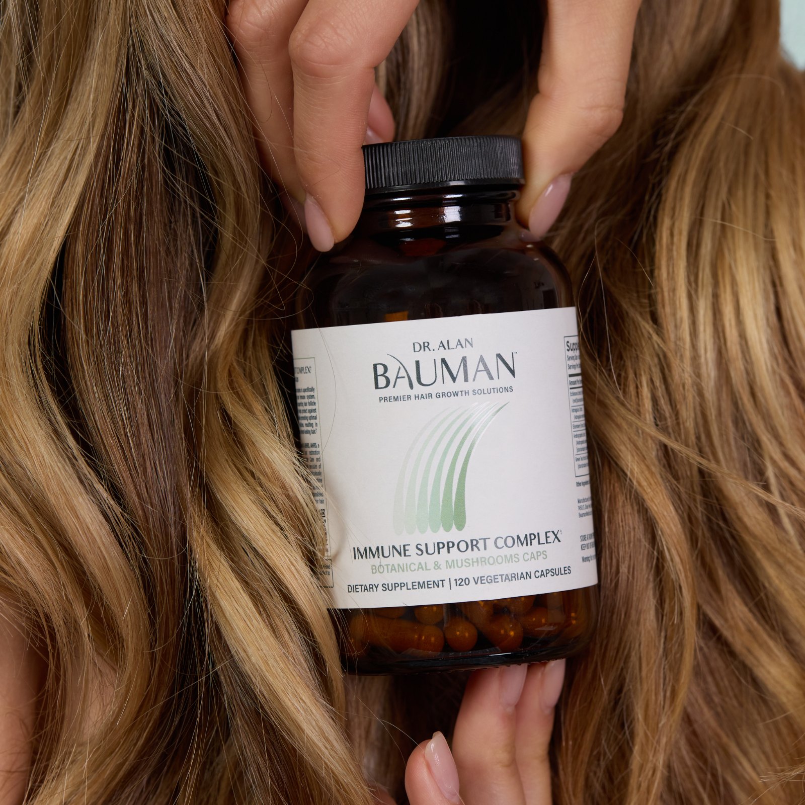 Bauman Immune Support Complex held in hair