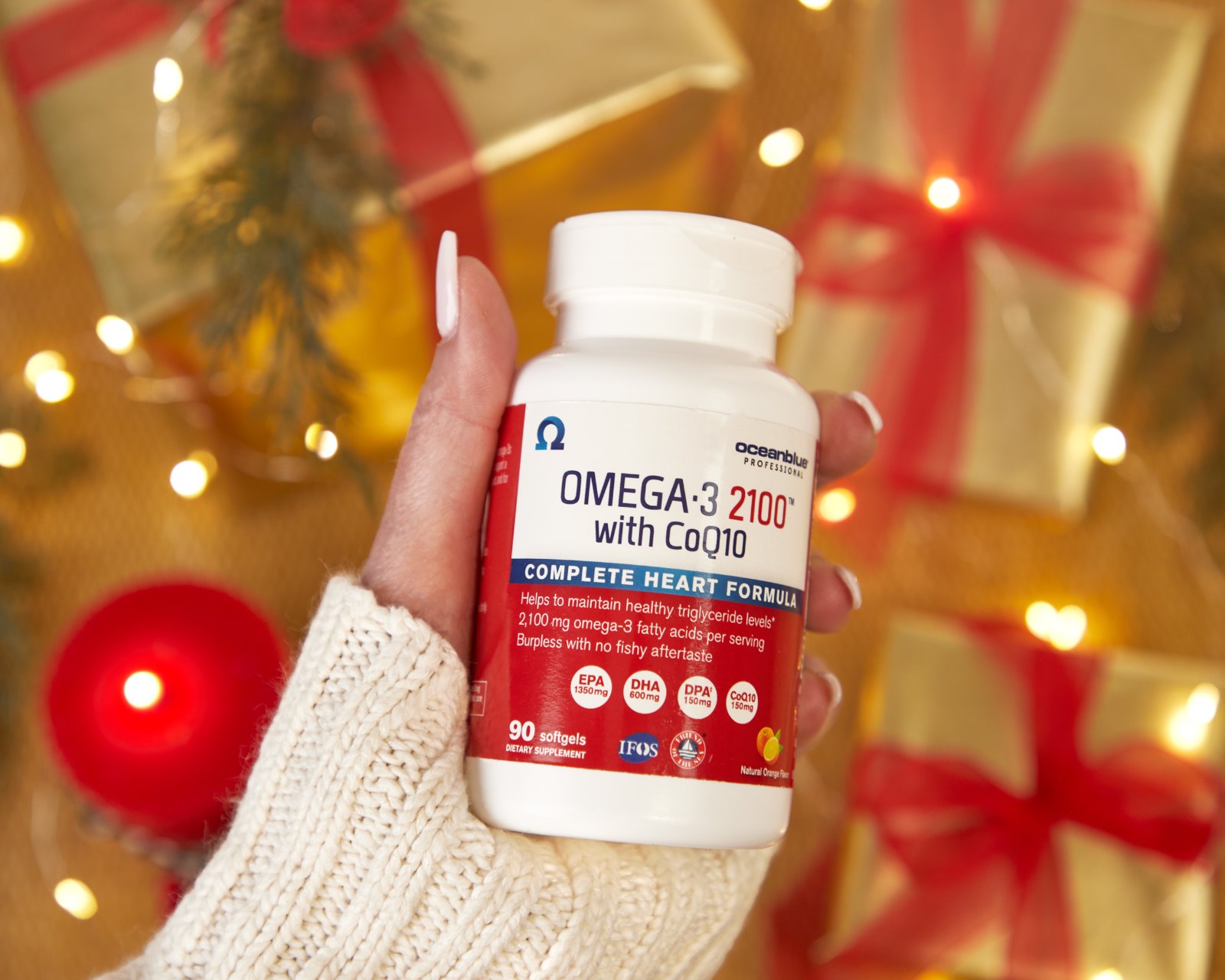 Oceanblue Omega-3 bottle held in holiday setting