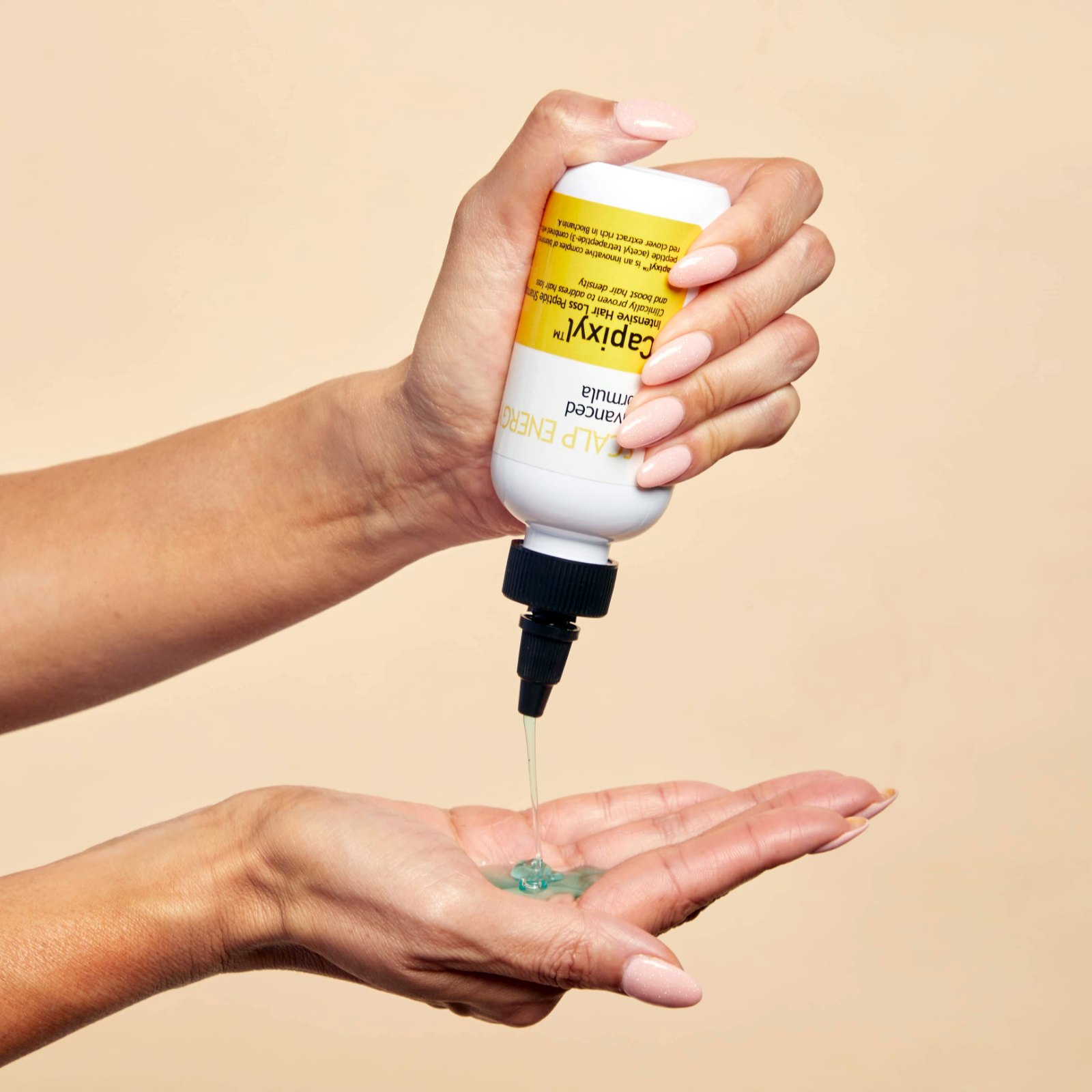 Scalp Delivery Capixyl shampoo poured into hand
